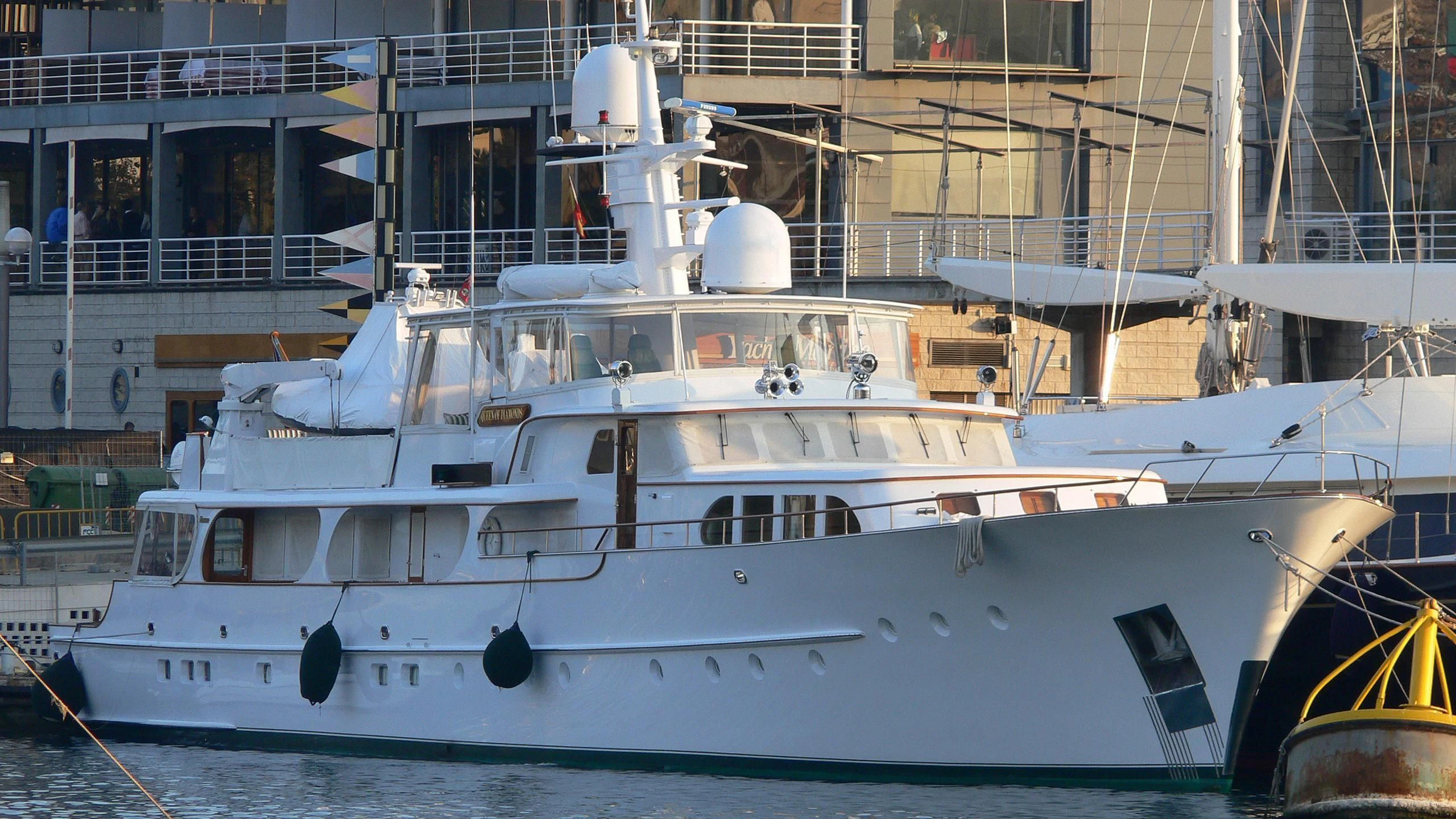 a white yacht in a harbor aboard MARYBELLE Yacht for Sale
