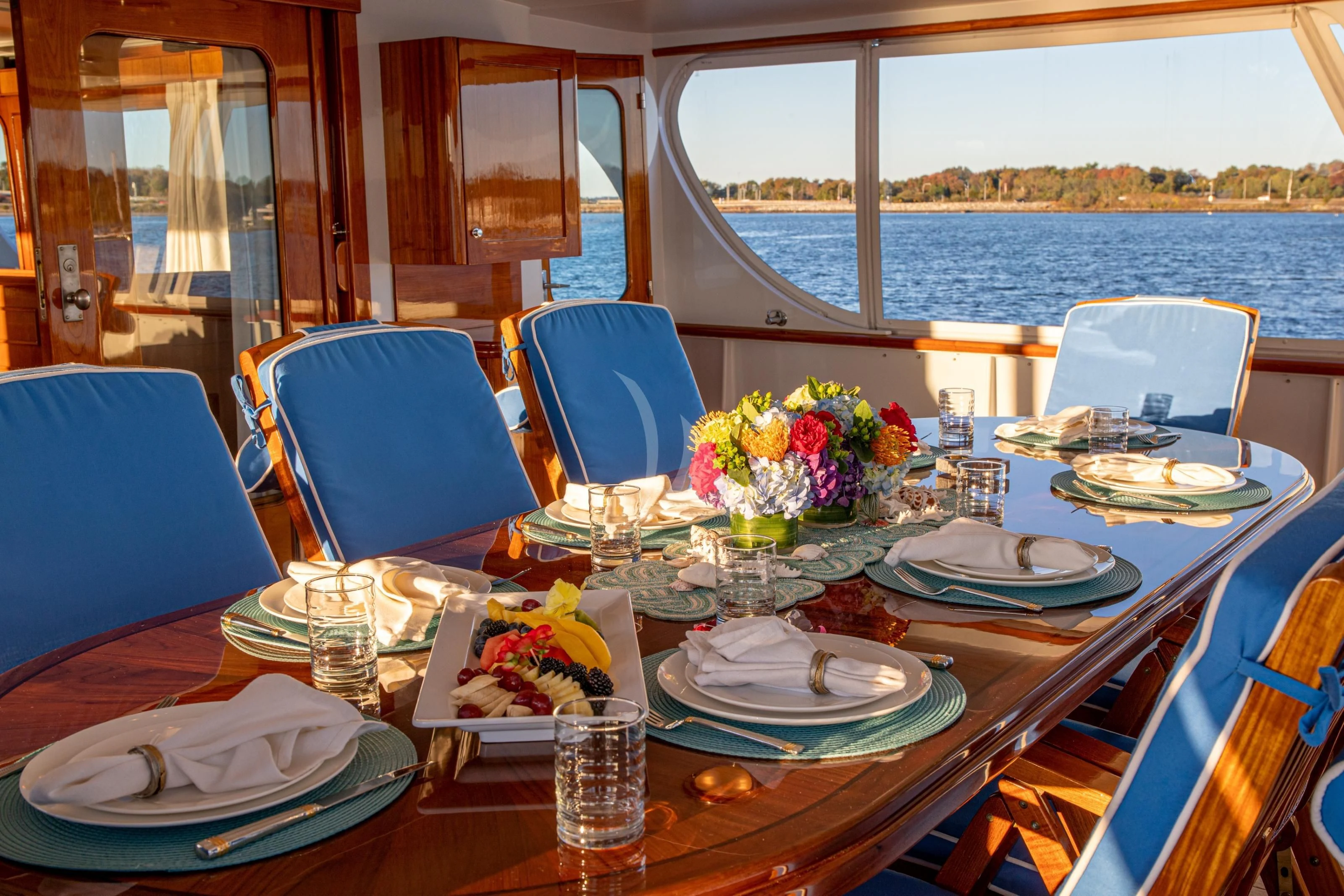 a table with plates and flowers on it aboard MARYBELLE Yacht for Sale