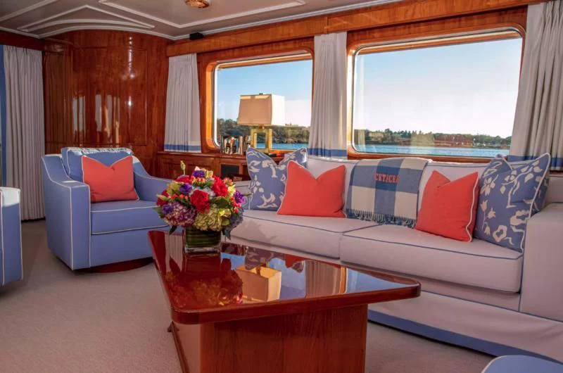 a living room with a couch and a coffee table aboard MARYBELLE Yacht for Sale