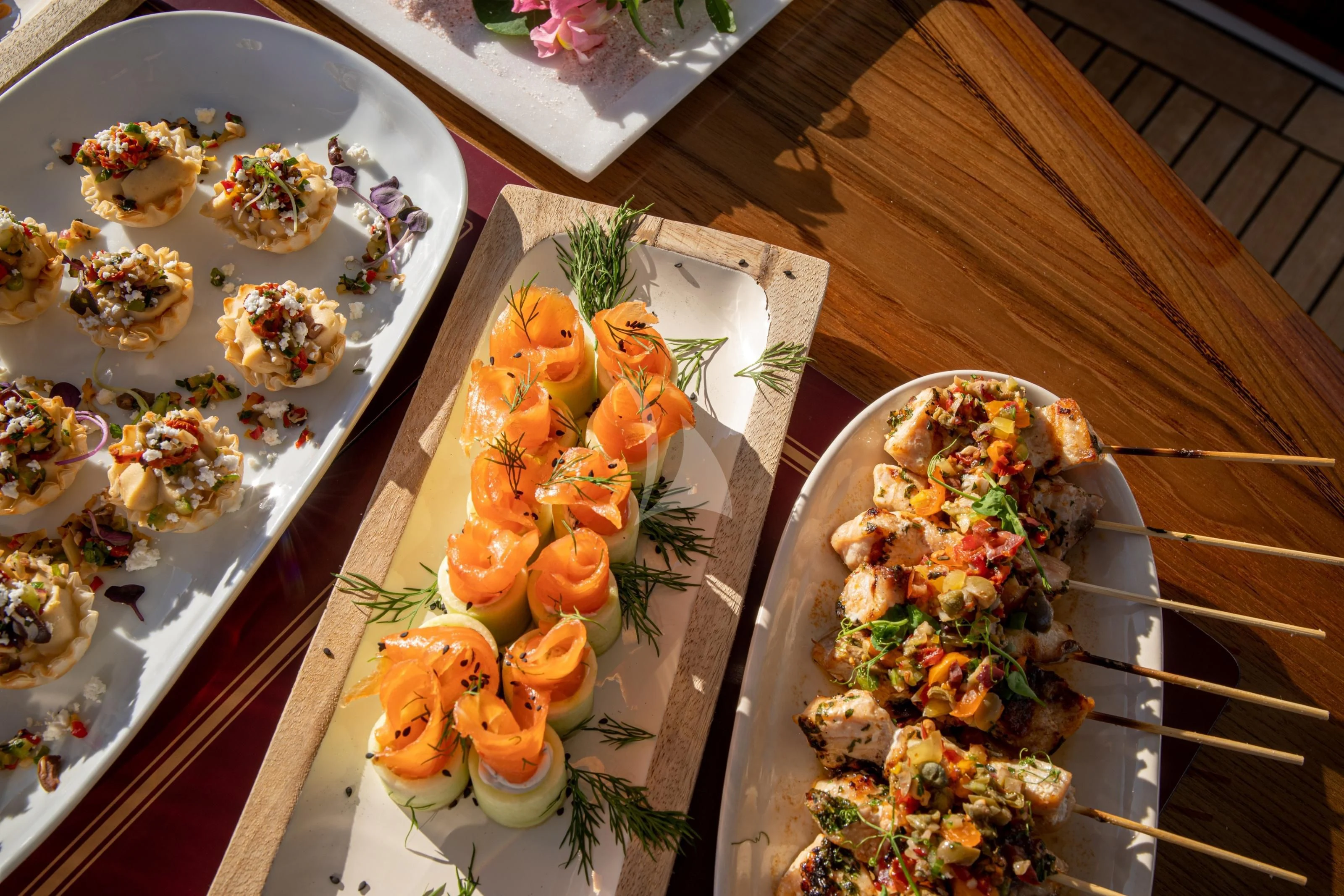 a table with plates of food aboard MARYBELLE Yacht for Sale