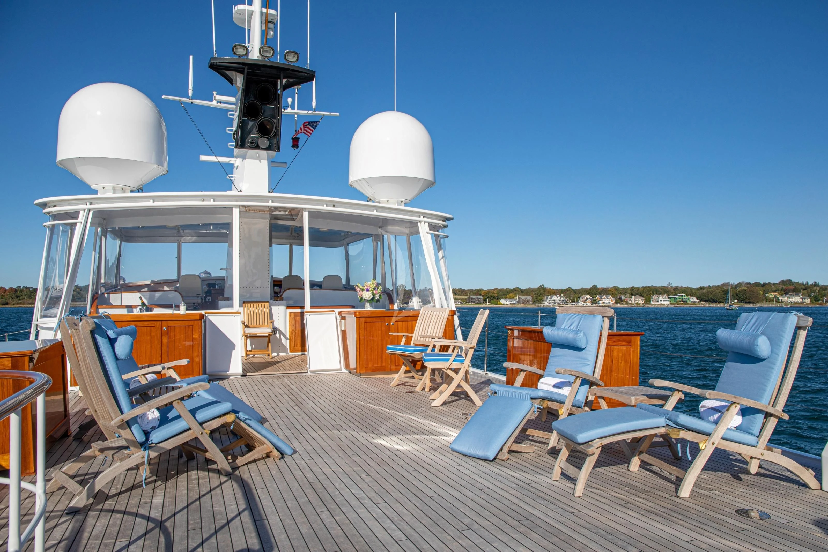 a deck with chairs and a table on it aboard MARYBELLE Yacht for Sale