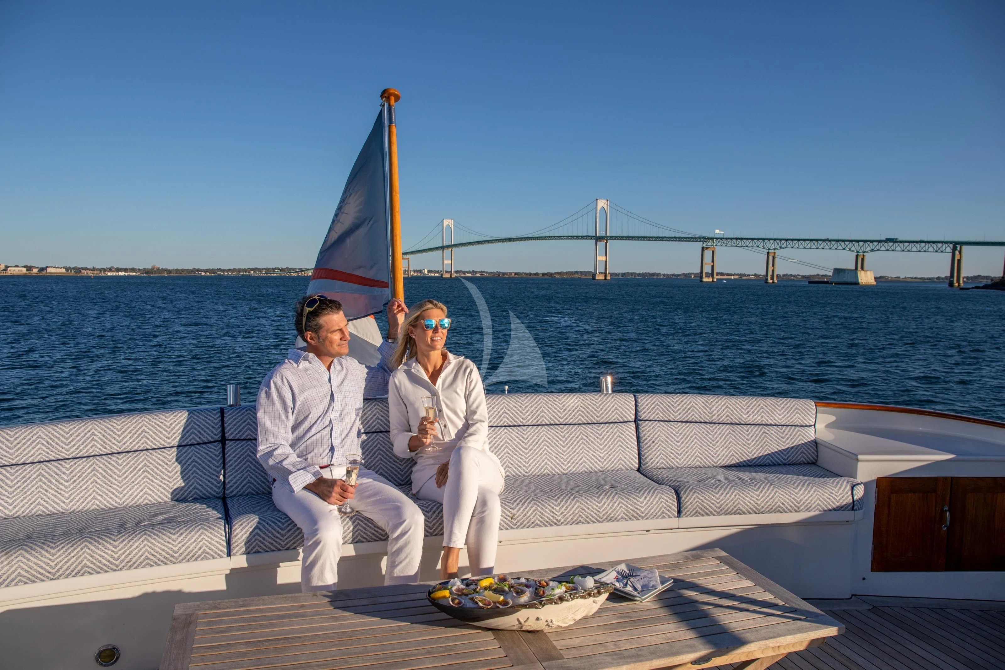 a couple sitting on a boat aboard MARYBELLE Yacht for Sale