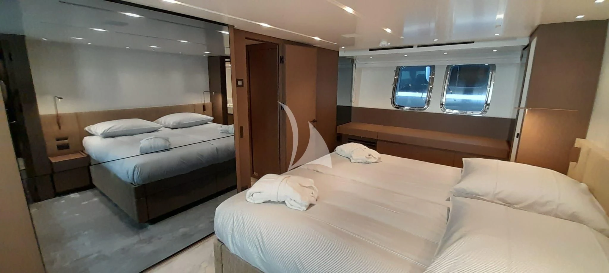 a room with beds and a window aboard SSL Yacht for Sale