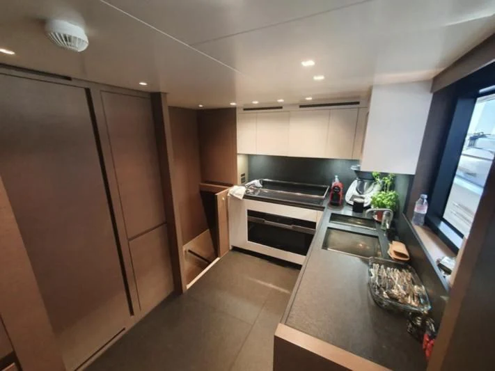a kitchen with a large island aboard SSL Yacht for Sale