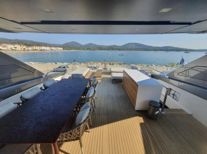 a deck with a view of a city and water aboard SSL Yacht for Sale
