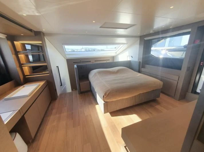 a room with a bed and a desk aboard SSL Yacht for Sale