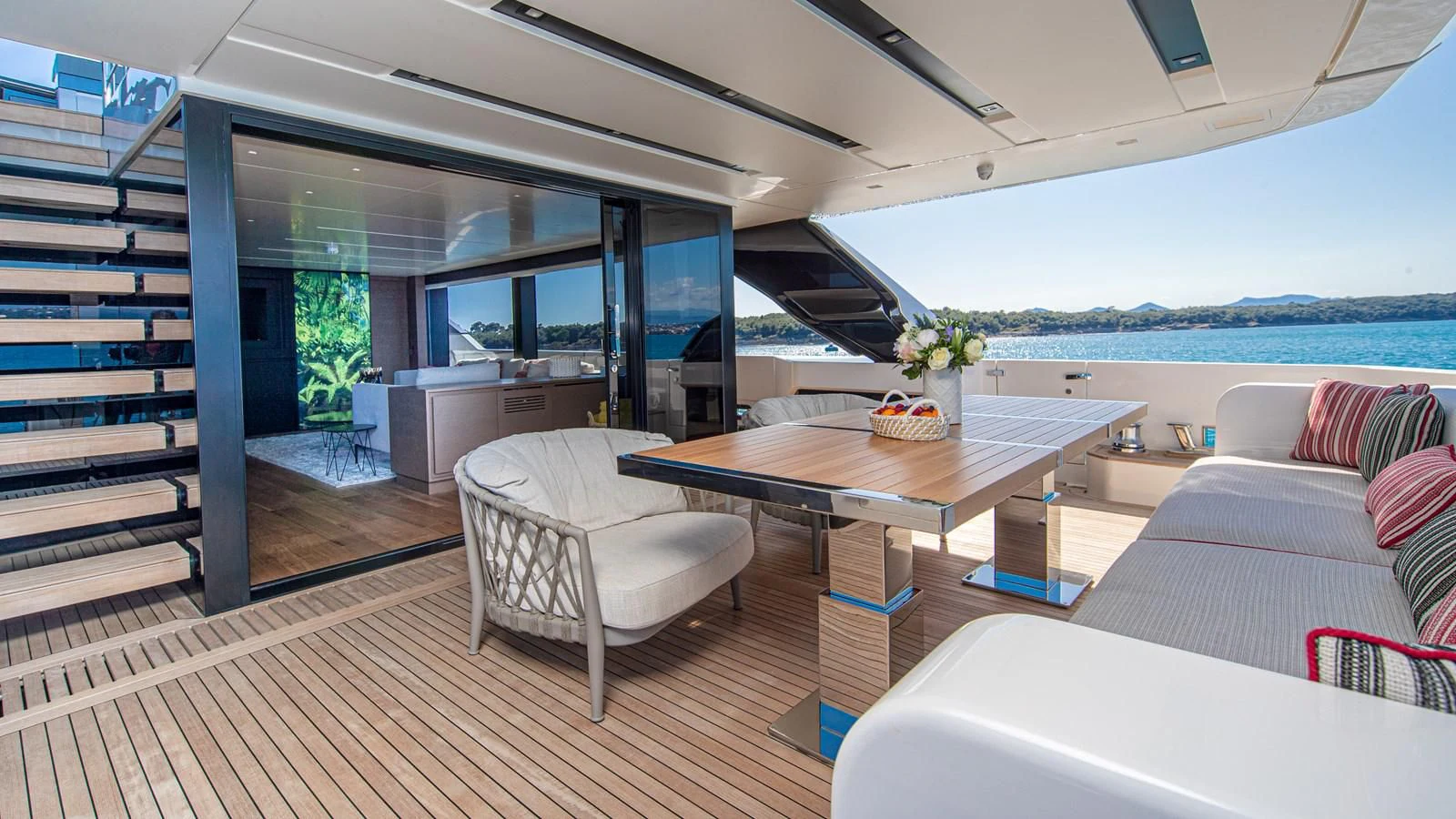 a living room with a table and chairs aboard SSL Yacht for Sale