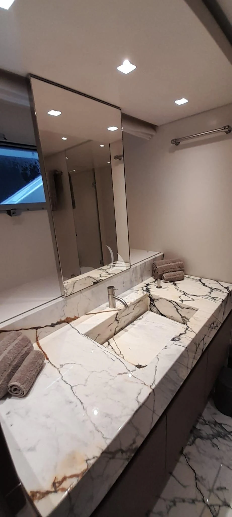 a bathroom with a large mirror aboard SSL Yacht for Sale