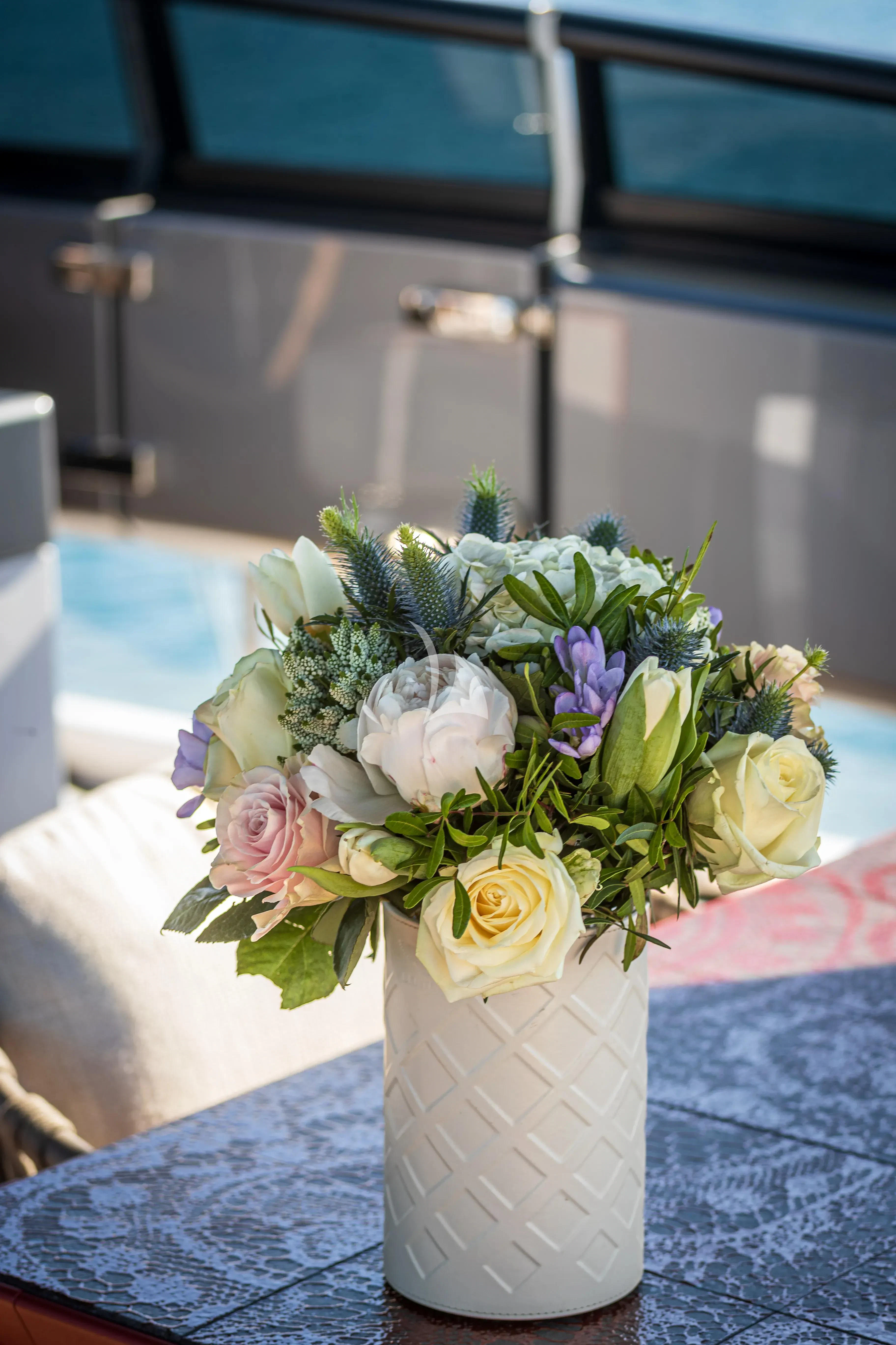 a vase with flowers in it aboard SSL Yacht for Sale