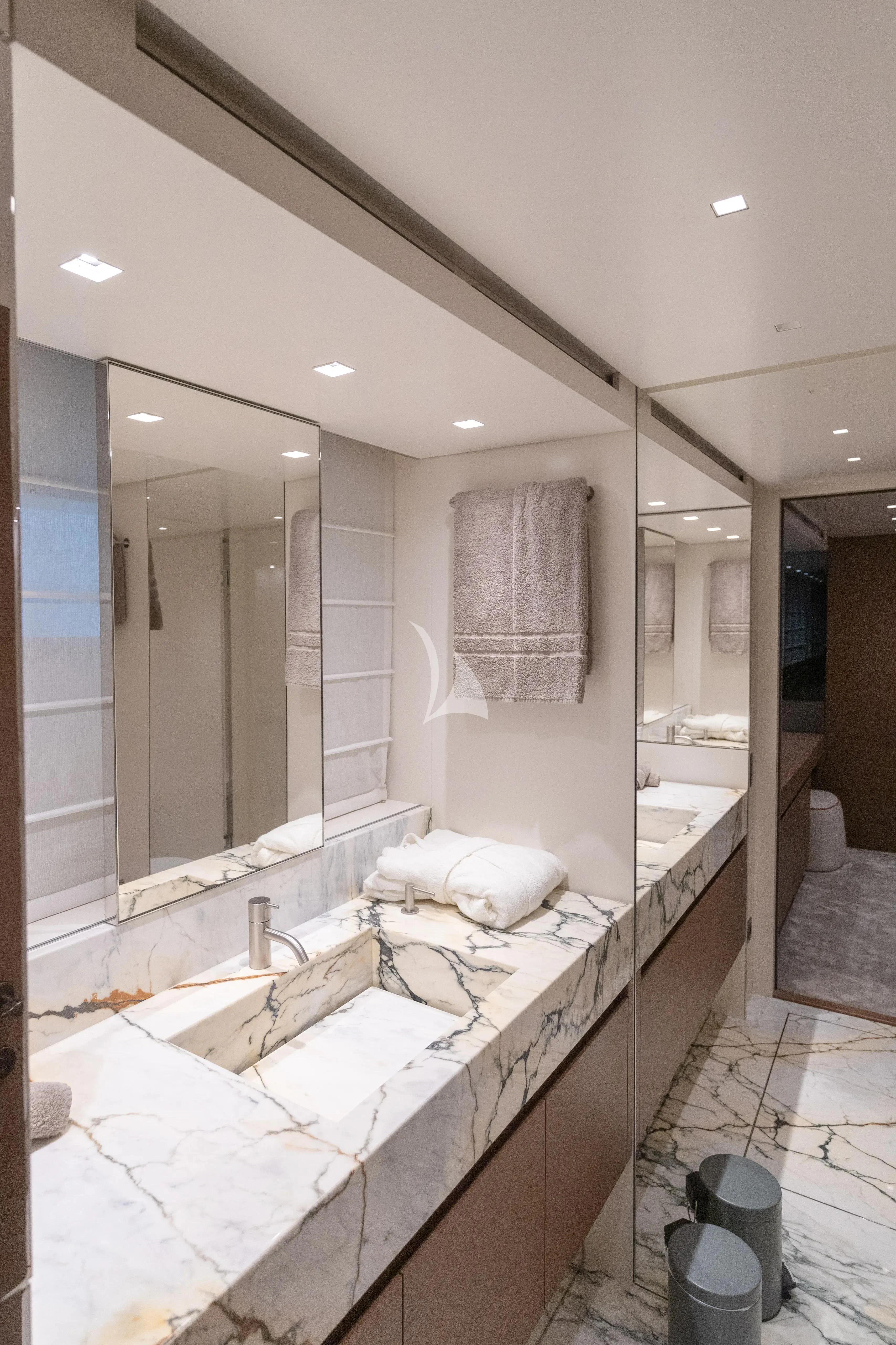 a bathroom with a large mirror aboard SSL Yacht for Sale