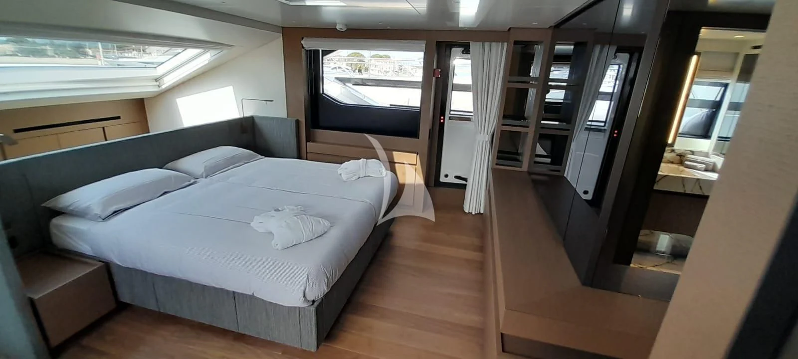 a room with a bed and a window aboard SSL Yacht for Sale