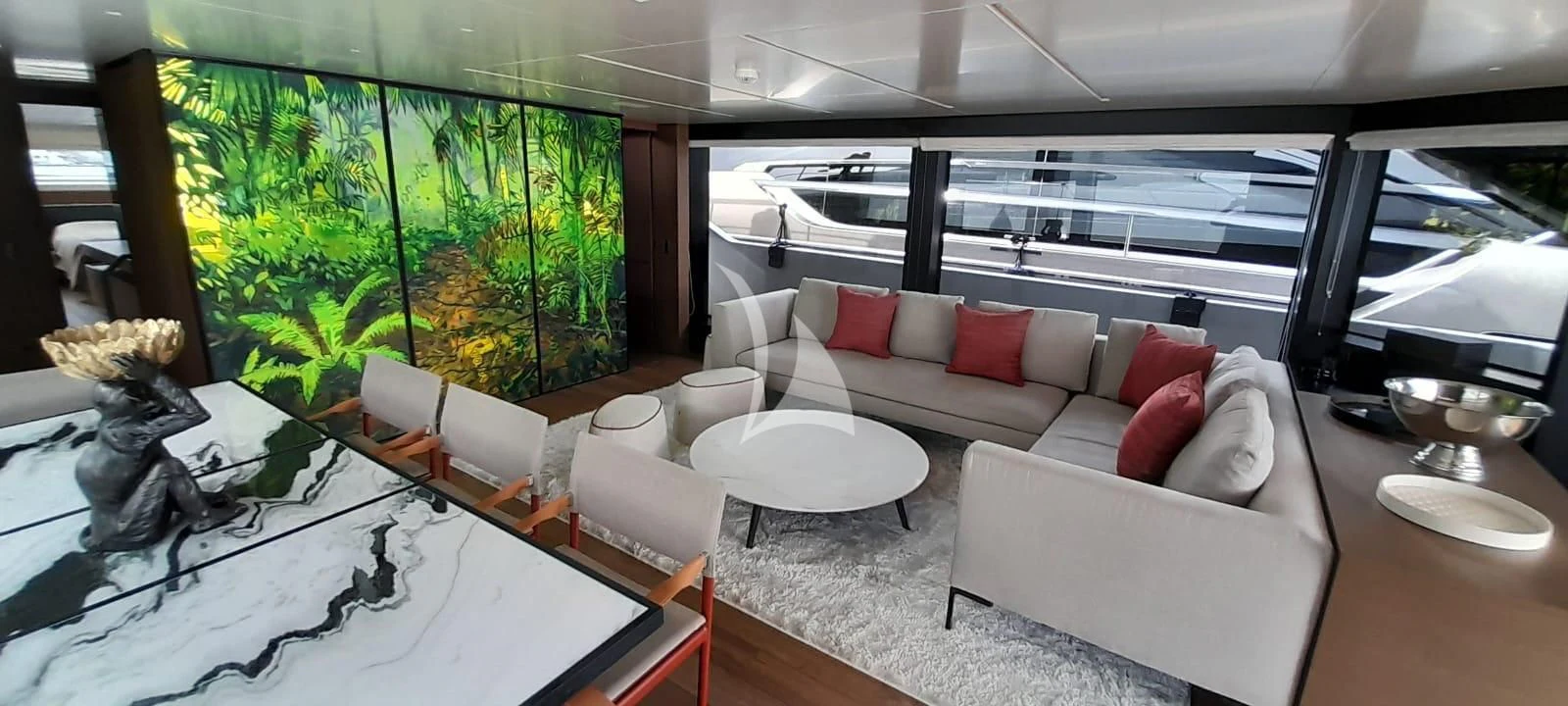 a living room with a large window aboard SSL Yacht for Sale