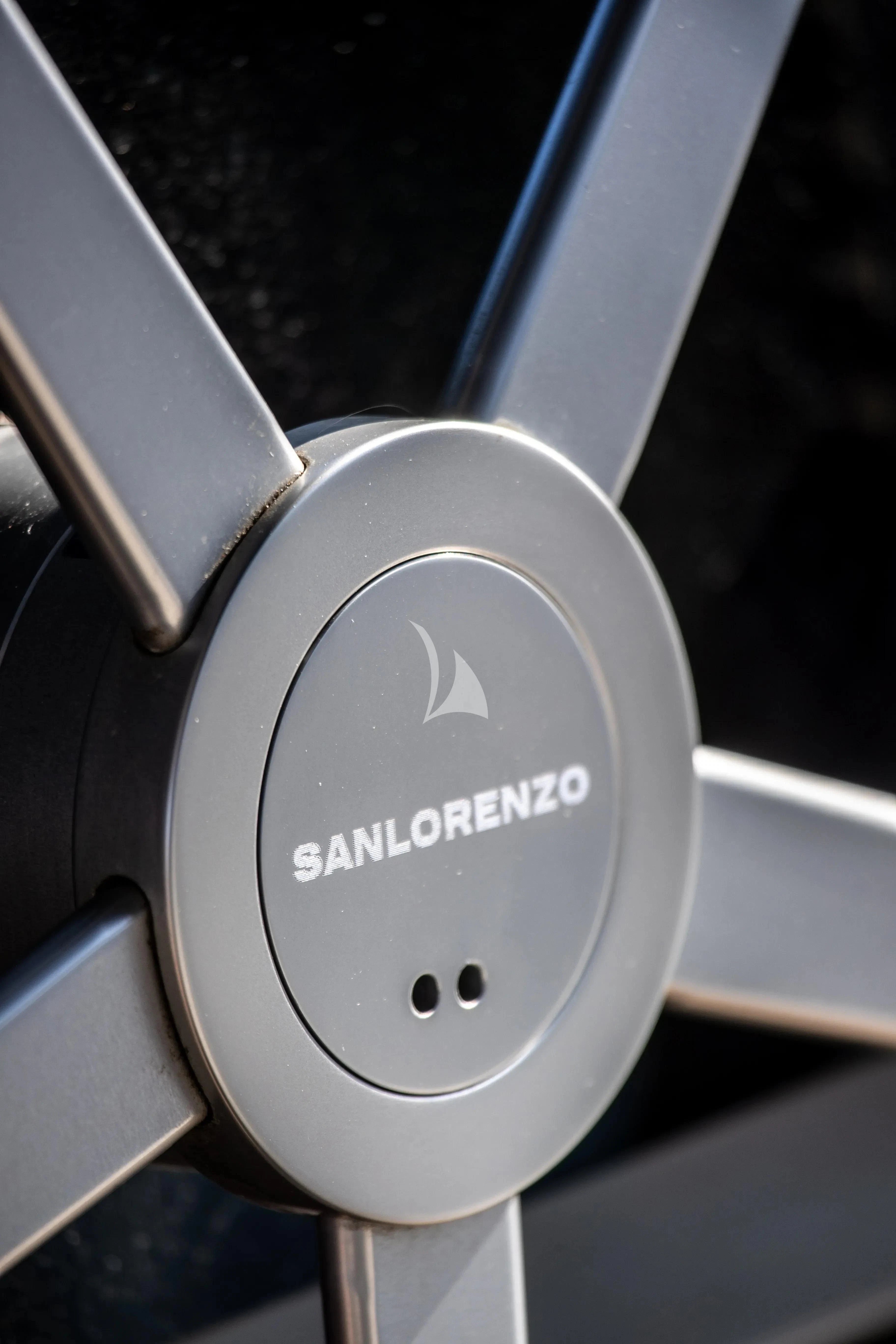 a white speaker with a logo on it aboard SSL Yacht for Sale