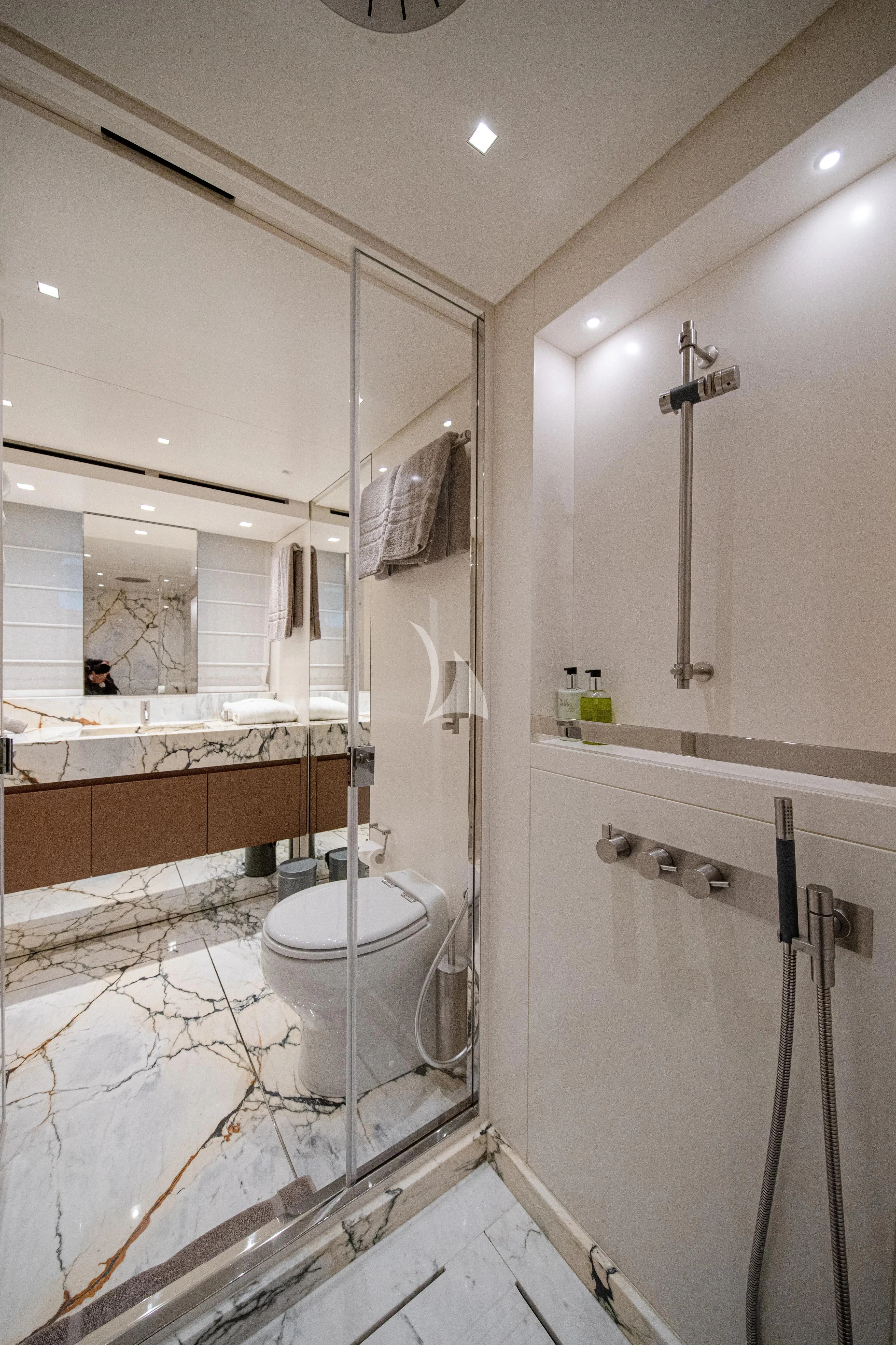 a bathroom with a shower and toilet aboard SSL Yacht for Sale