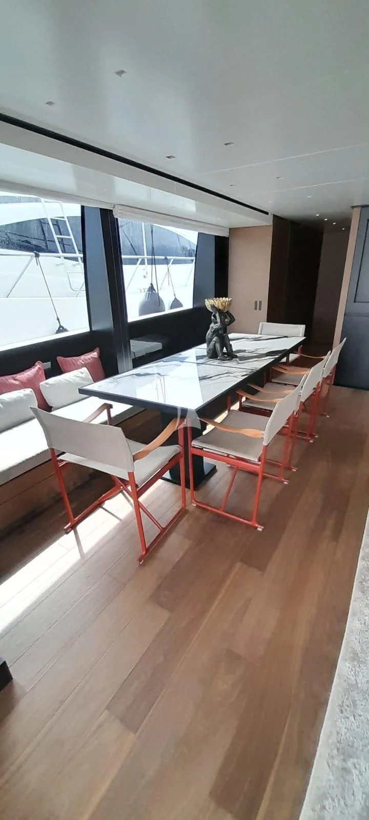 a room with a table and chairs aboard SSL Yacht for Sale