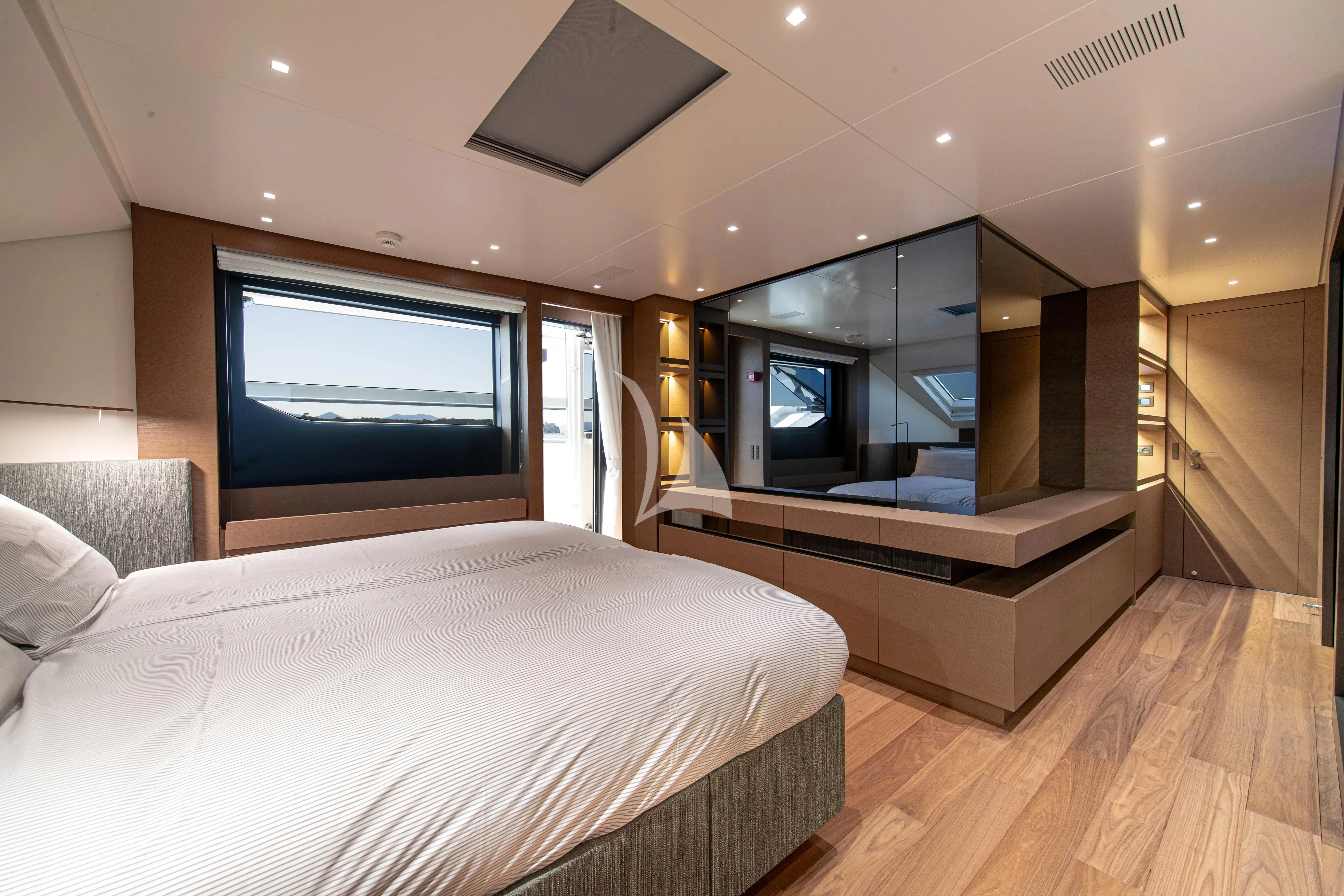 a room with a bed and a tv aboard SSL Yacht for Sale