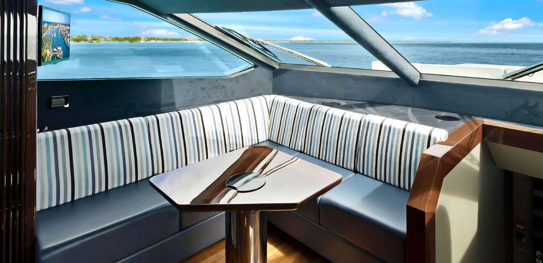 a room with a table and chairs aboard SYNERGY Yacht for Sale