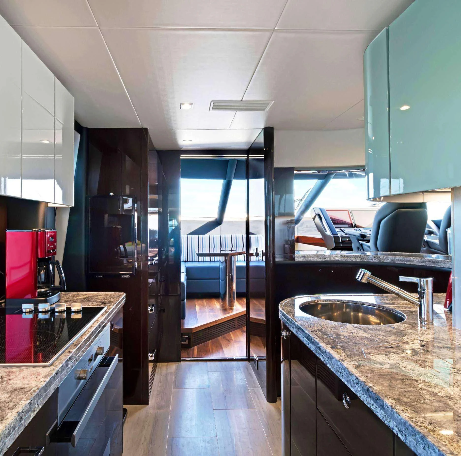 a kitchen with a sink and cabinets aboard SYNERGY Yacht for Sale