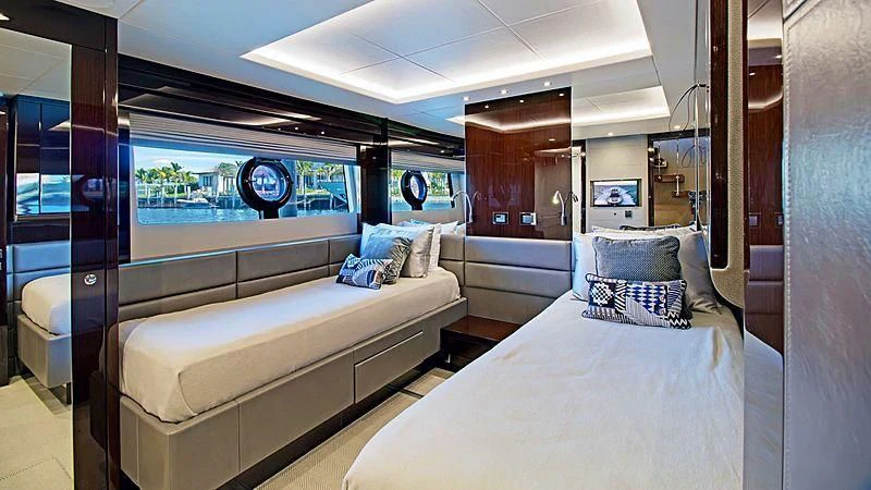 a room with a bed and a couch aboard SYNERGY Yacht for Sale