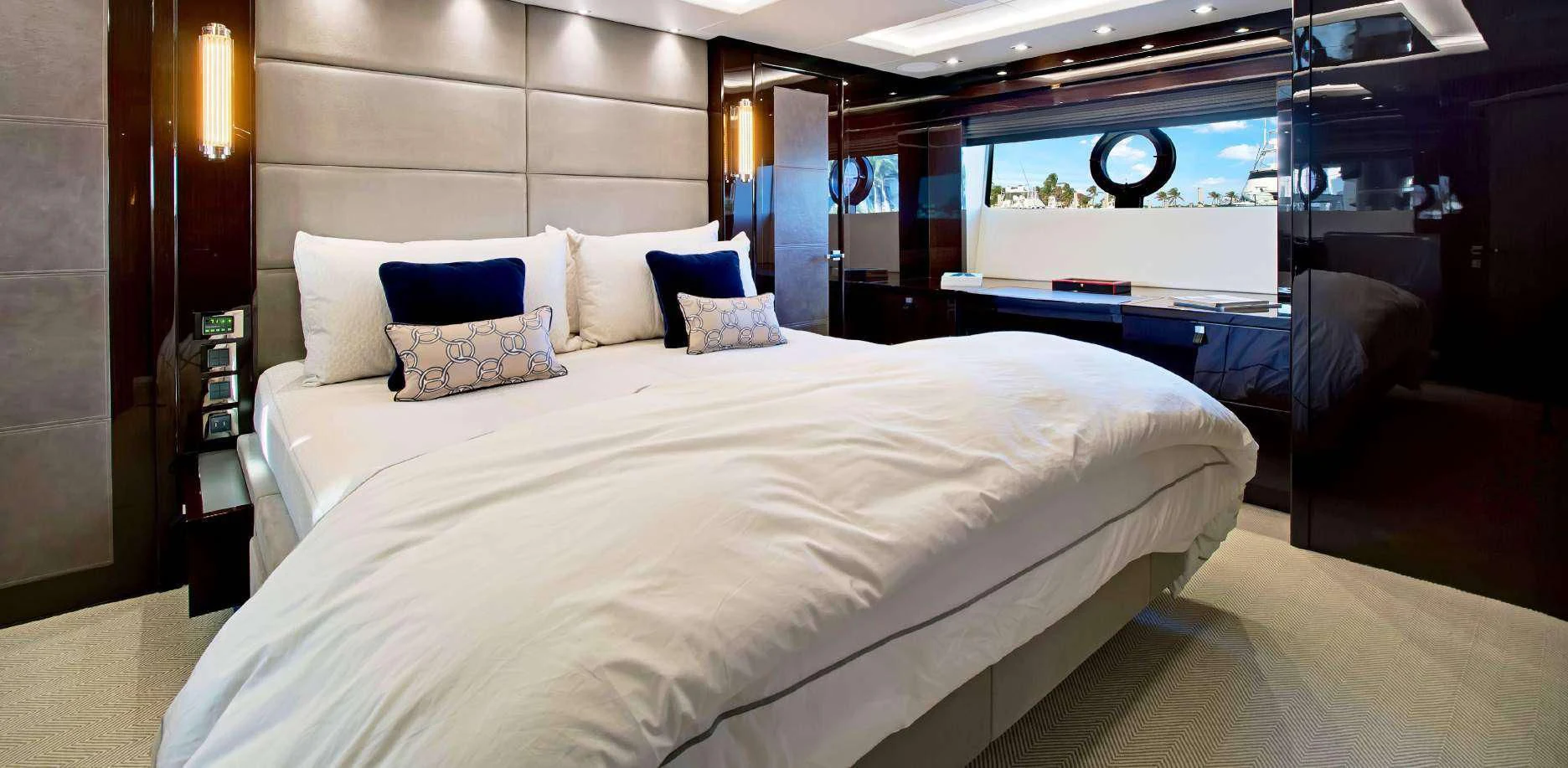 a room with a bed and a desk aboard SYNERGY Yacht for Sale