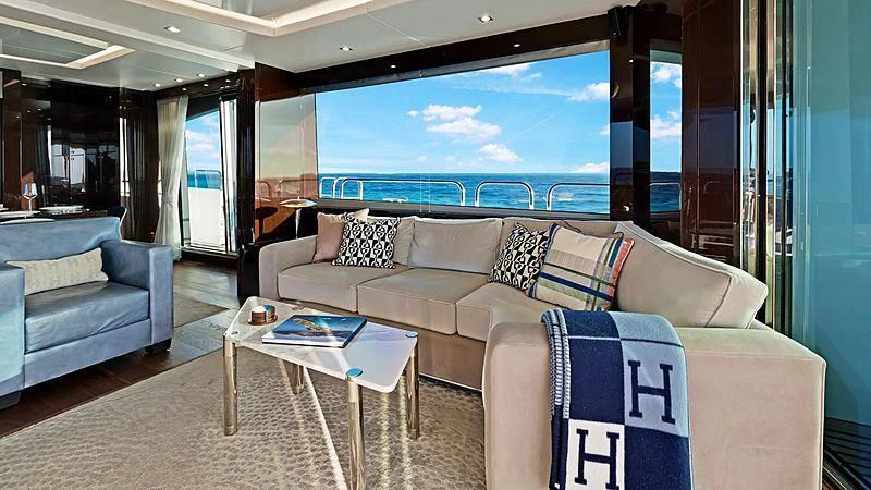 a living room with a large window aboard SYNERGY Yacht for Sale