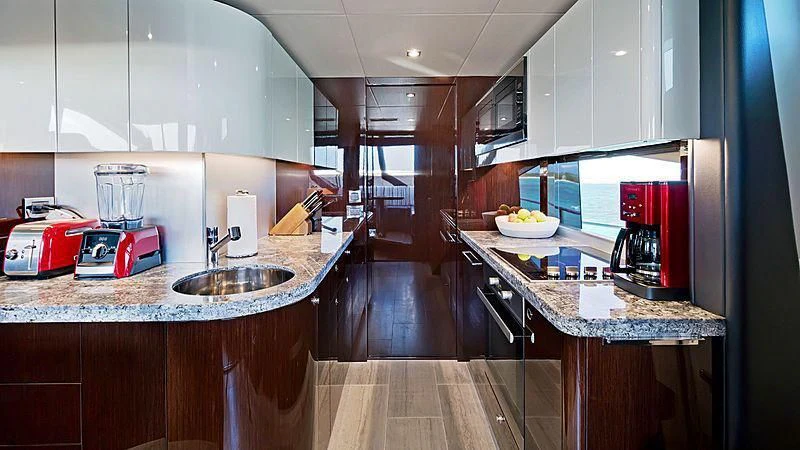 a kitchen with a microwave oven and a sink aboard SYNERGY Yacht for Sale