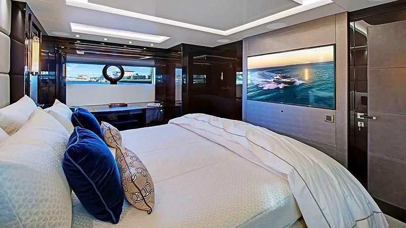 a room with a bed and a tv aboard SYNERGY Yacht for Sale