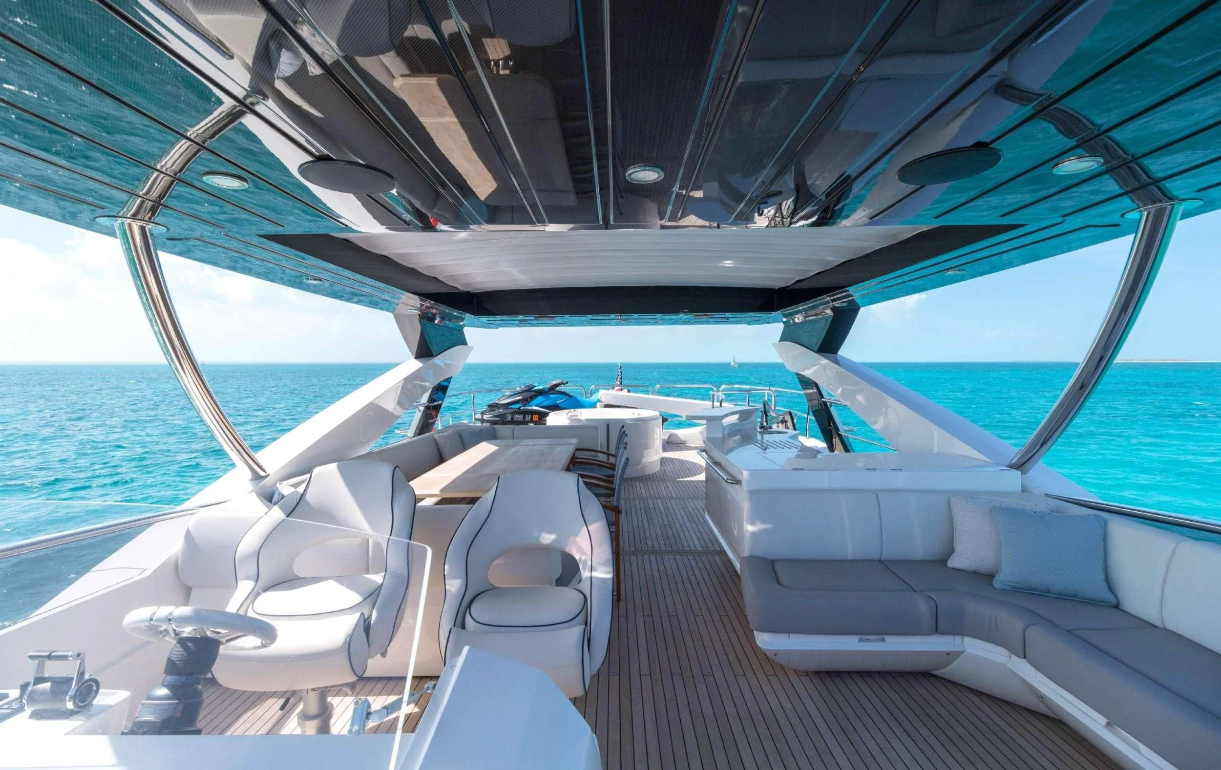 a deck with a view of the ocean and the deck aboard SYNERGY Yacht for Sale