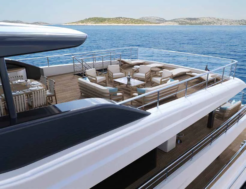 a deck with chairs and tables on it aboard ENZO Yacht for Sale