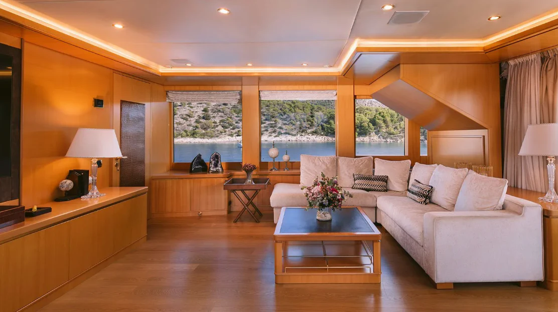 a living room with a large window aboard OASIS Yacht for Sale