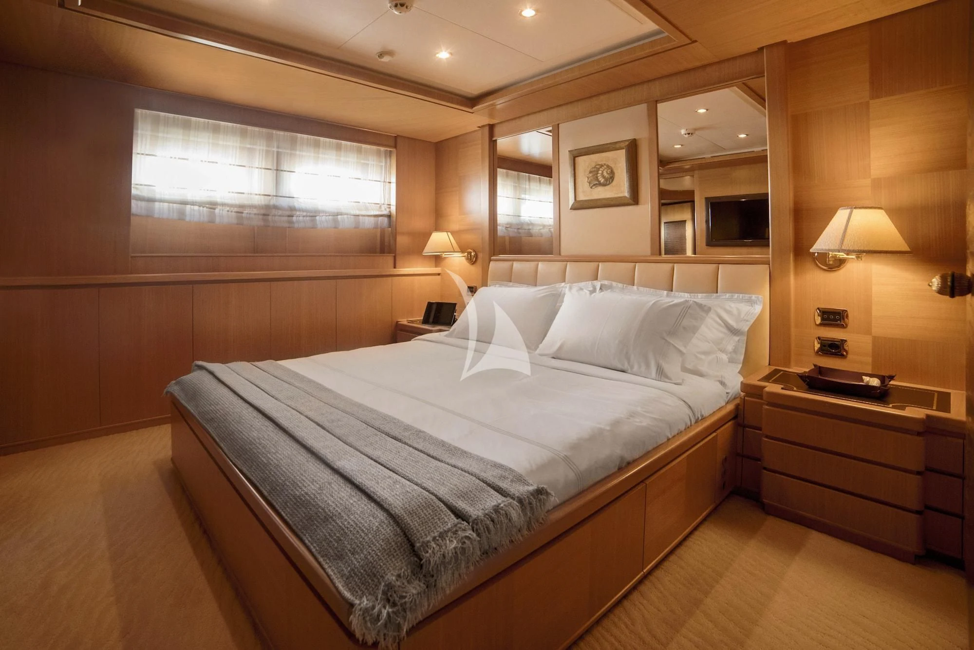 a large bed in a hotel room aboard OASIS Yacht for Sale
