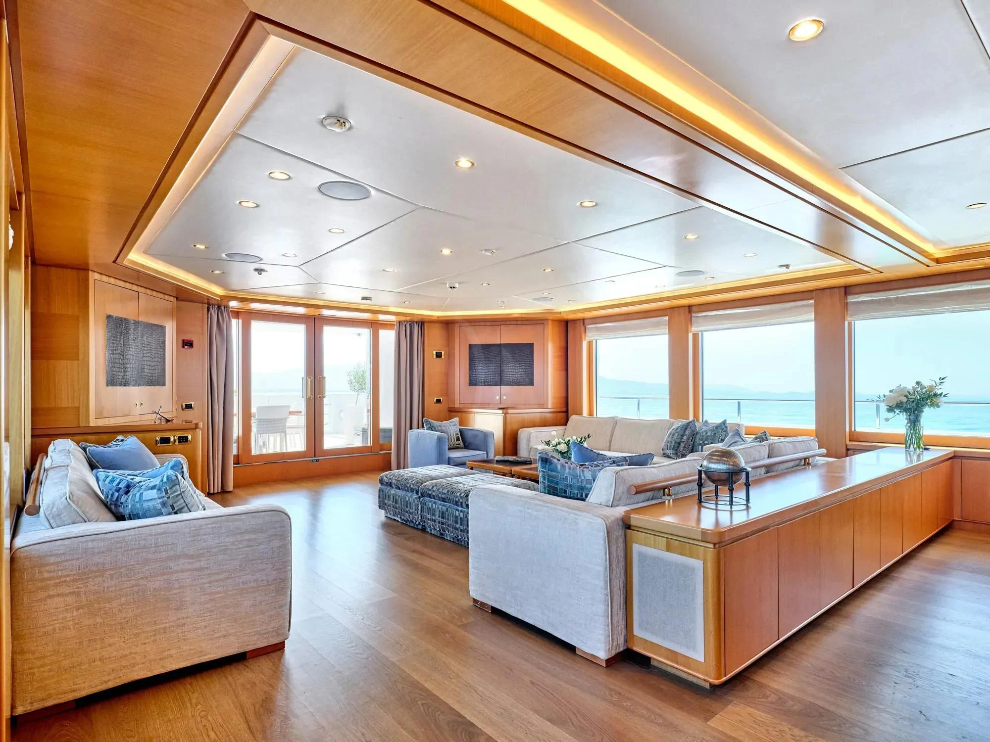 a large living room with a large open floor plan aboard OASIS Yacht for Sale