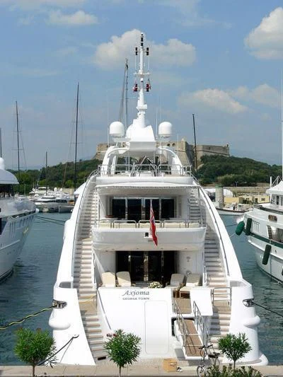 a boat docked at a pier aboard OASIS Yacht for Sale