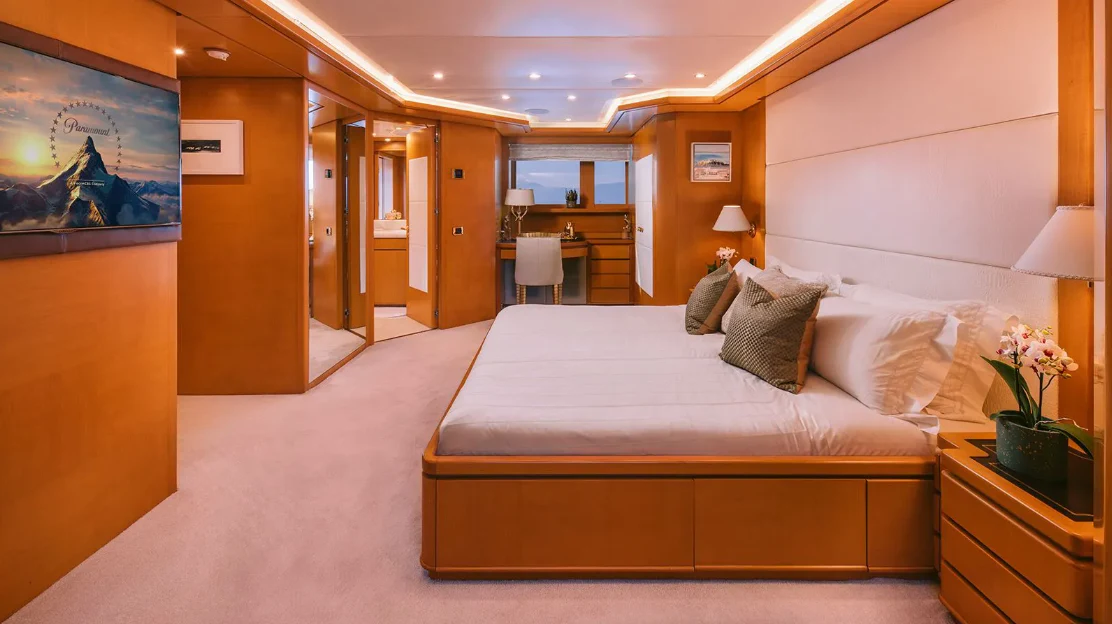 a large hotel room with a bed aboard OASIS Yacht for Sale