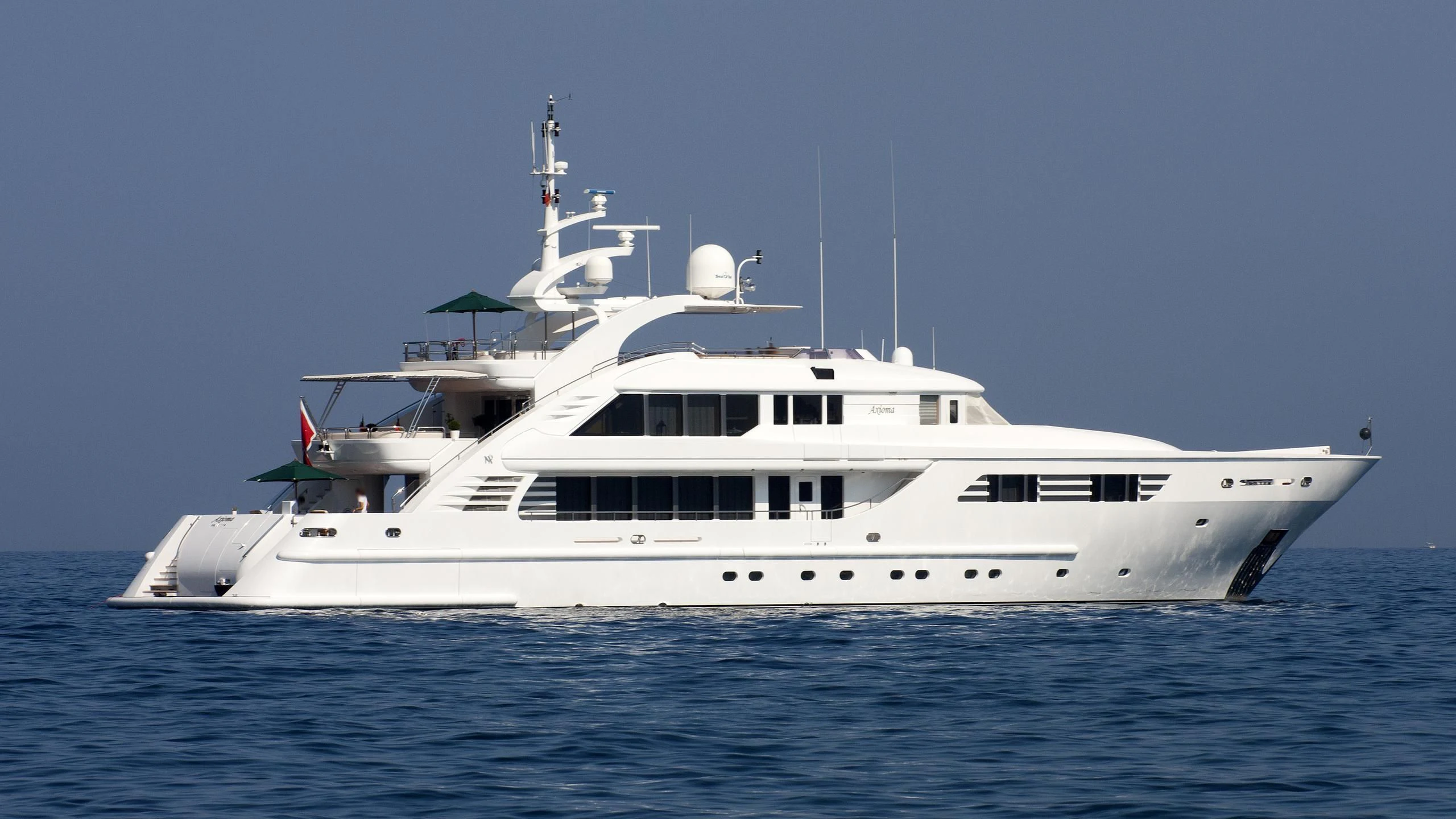 a white yacht on the water aboard OASIS Yacht for Sale