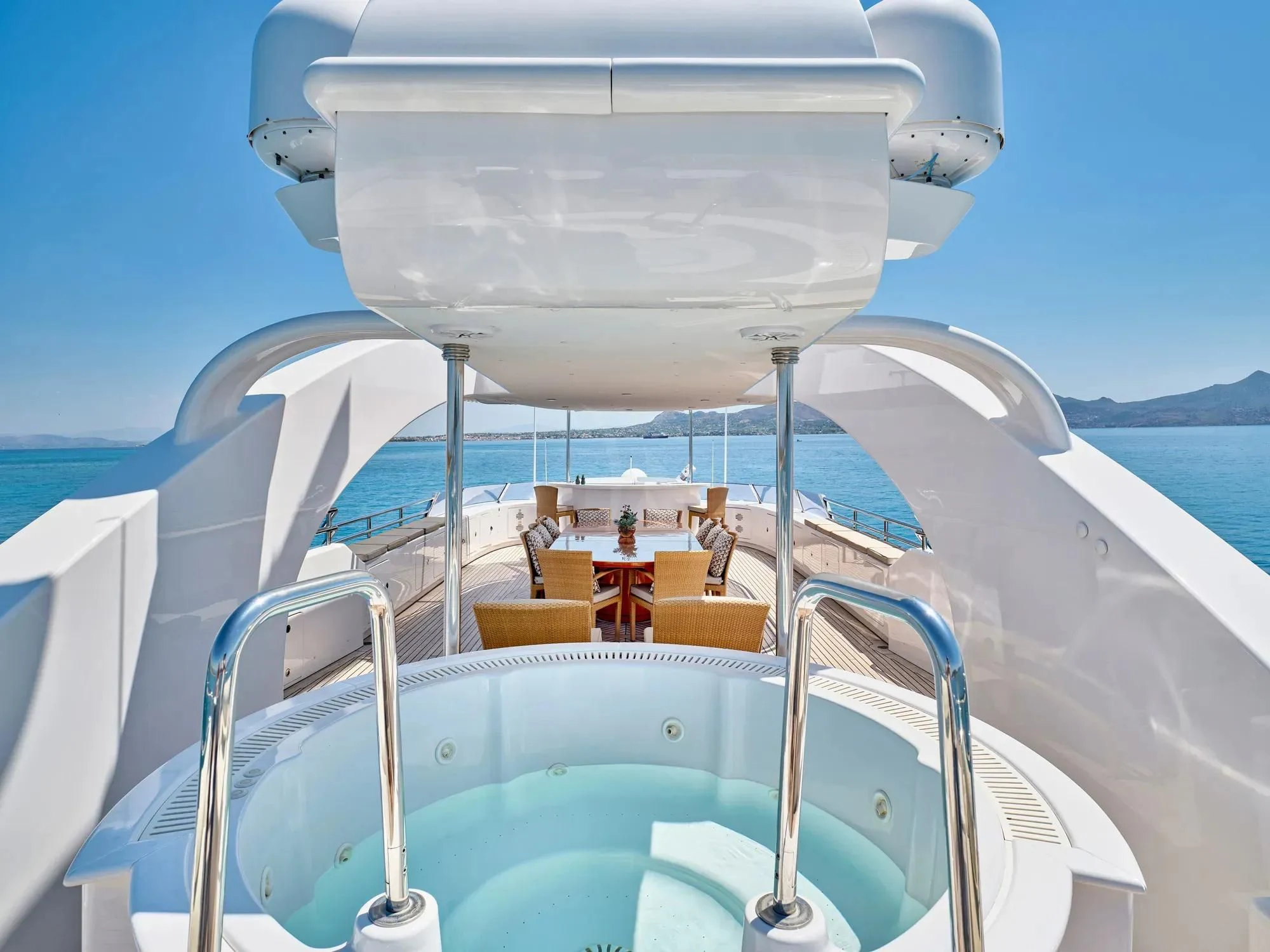 a boat with a small sail aboard OASIS Yacht for Sale