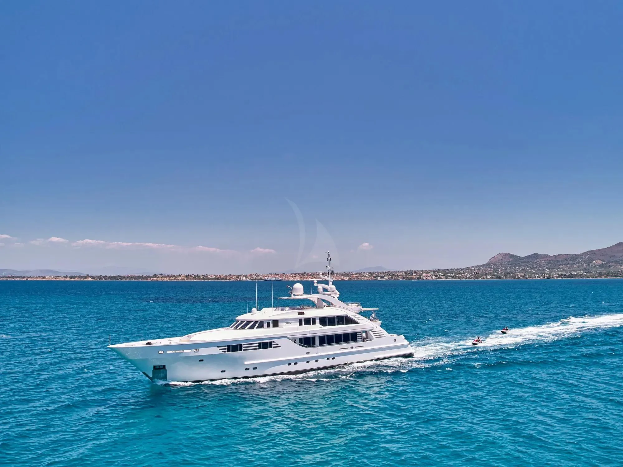 a white boat on the water aboard OASIS Yacht for Sale