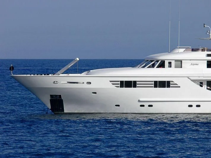 a white boat in the water aboard OASIS Yacht for Sale