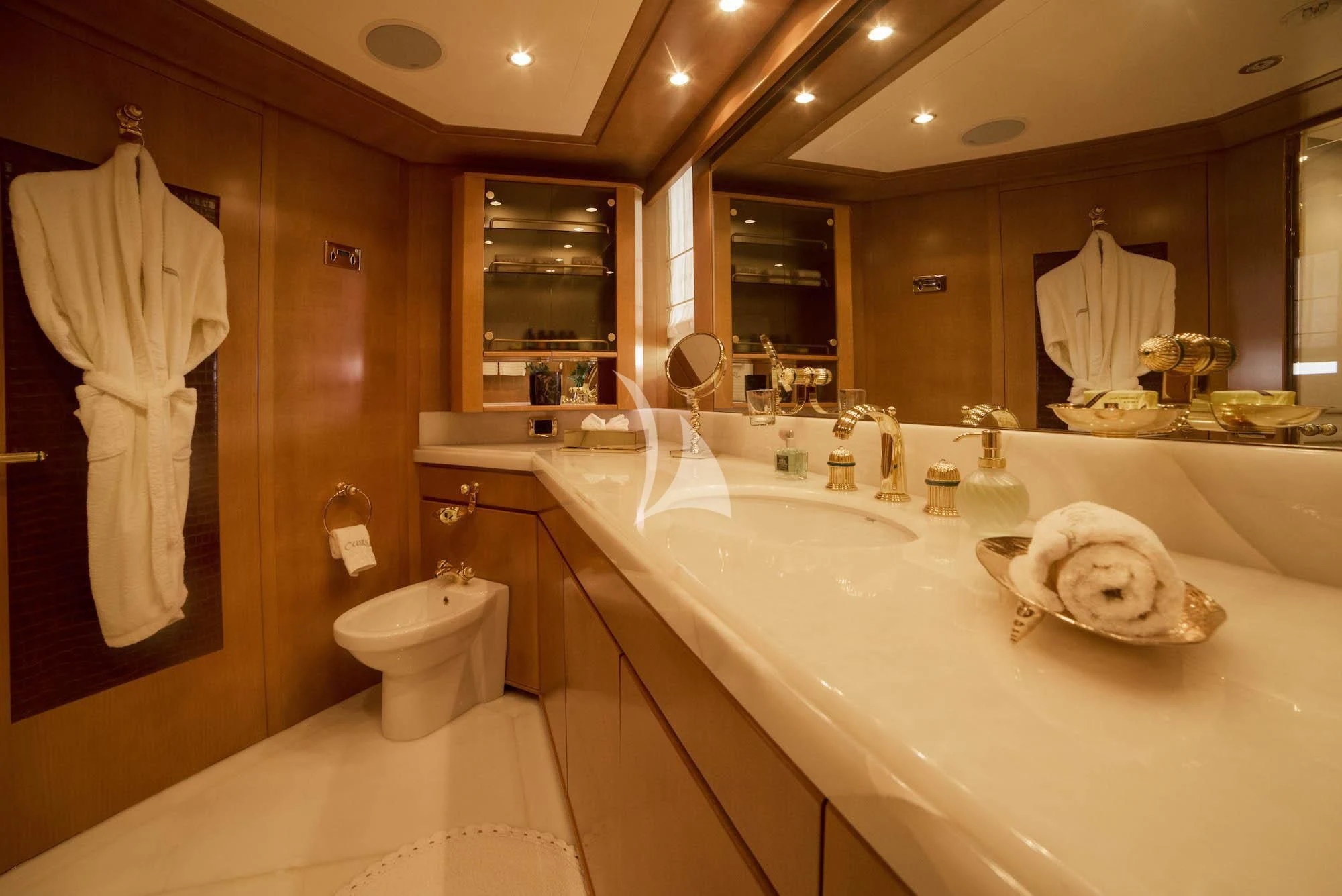 a bathroom with a large mirror aboard OASIS Yacht for Sale