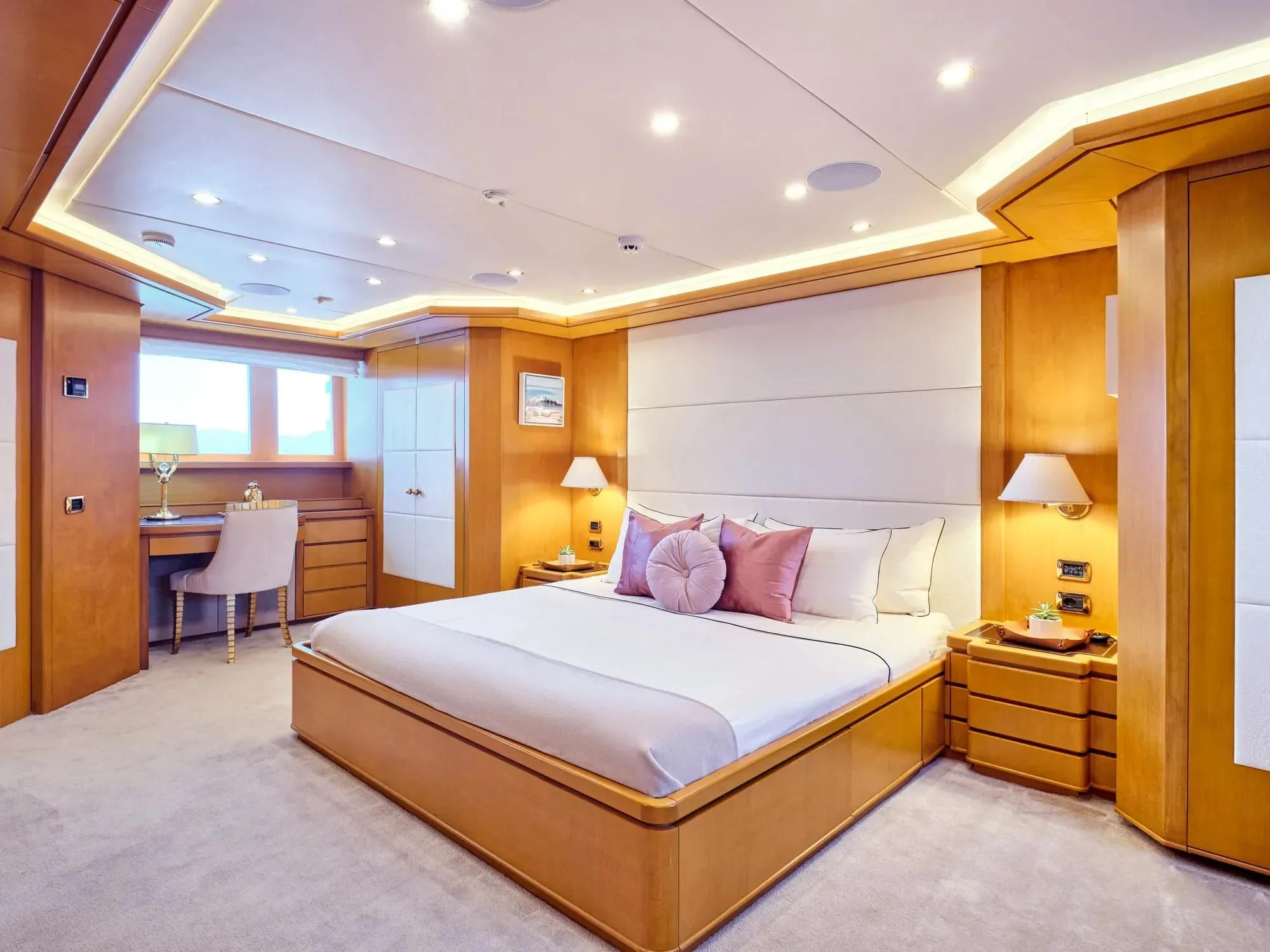 a large bedroom with a large bed aboard OASIS Yacht for Sale