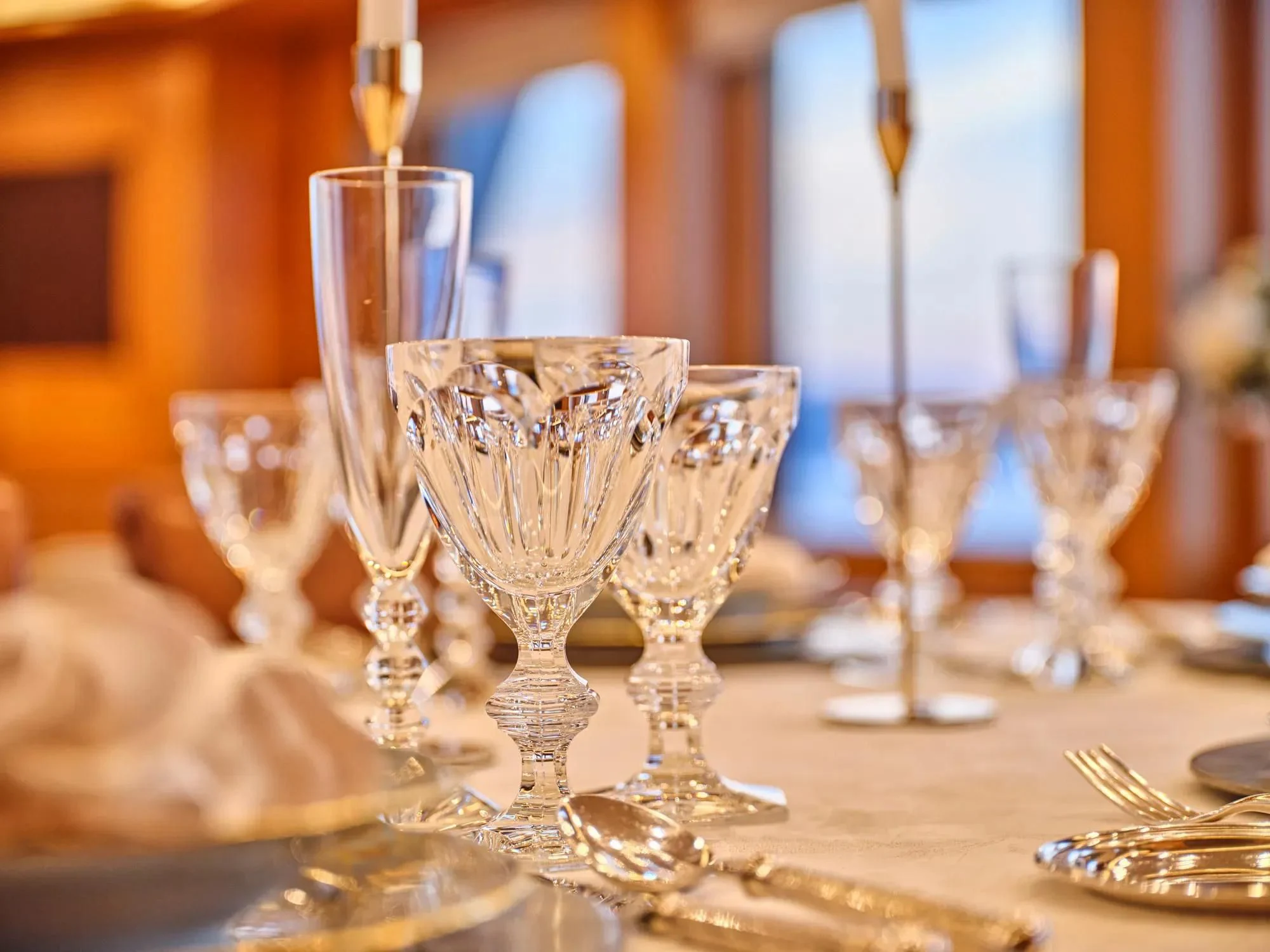 a group of glasses on a table aboard OASIS Yacht for Sale