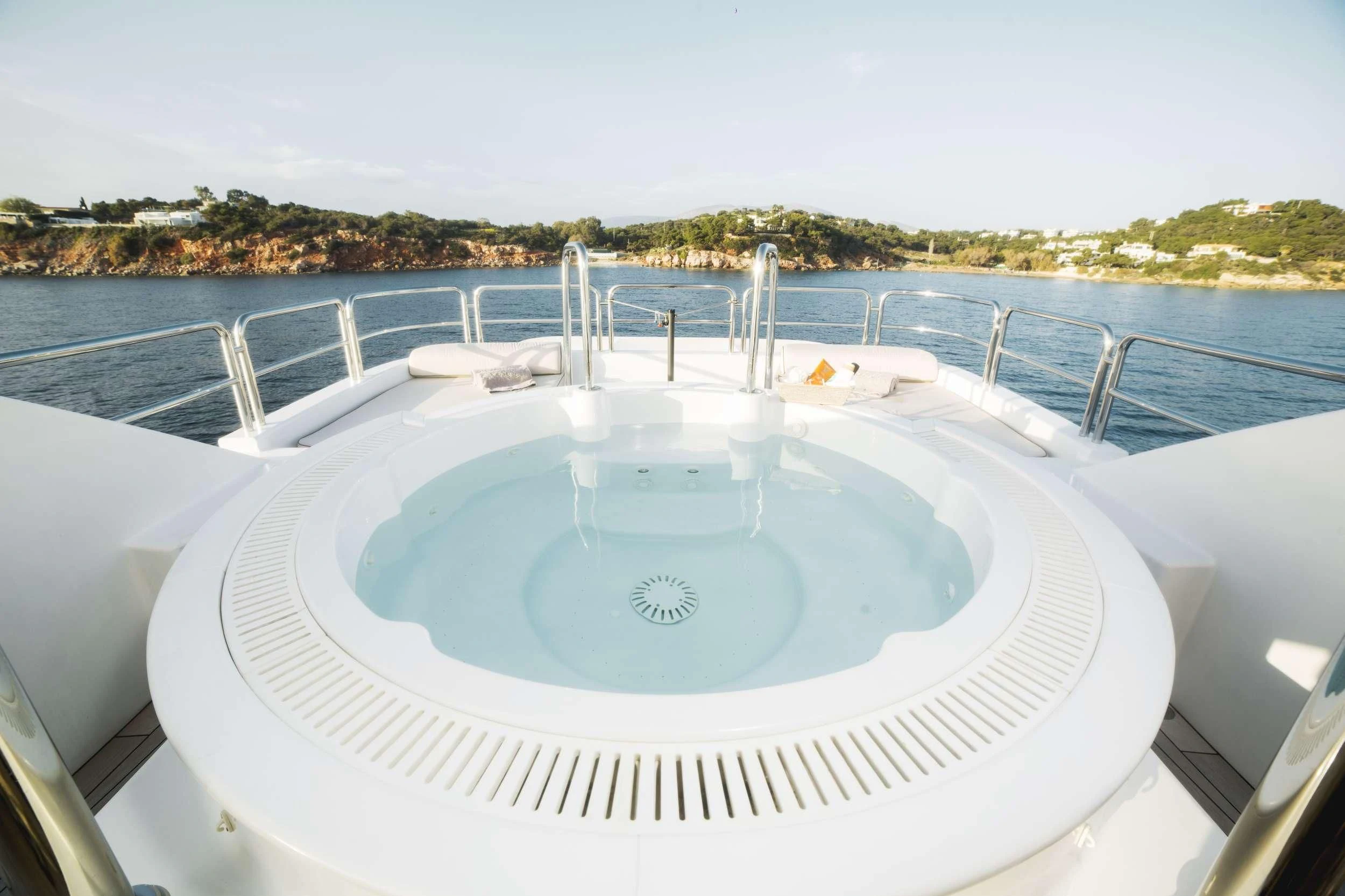 a large white swimming pool aboard OASIS Yacht for Sale
