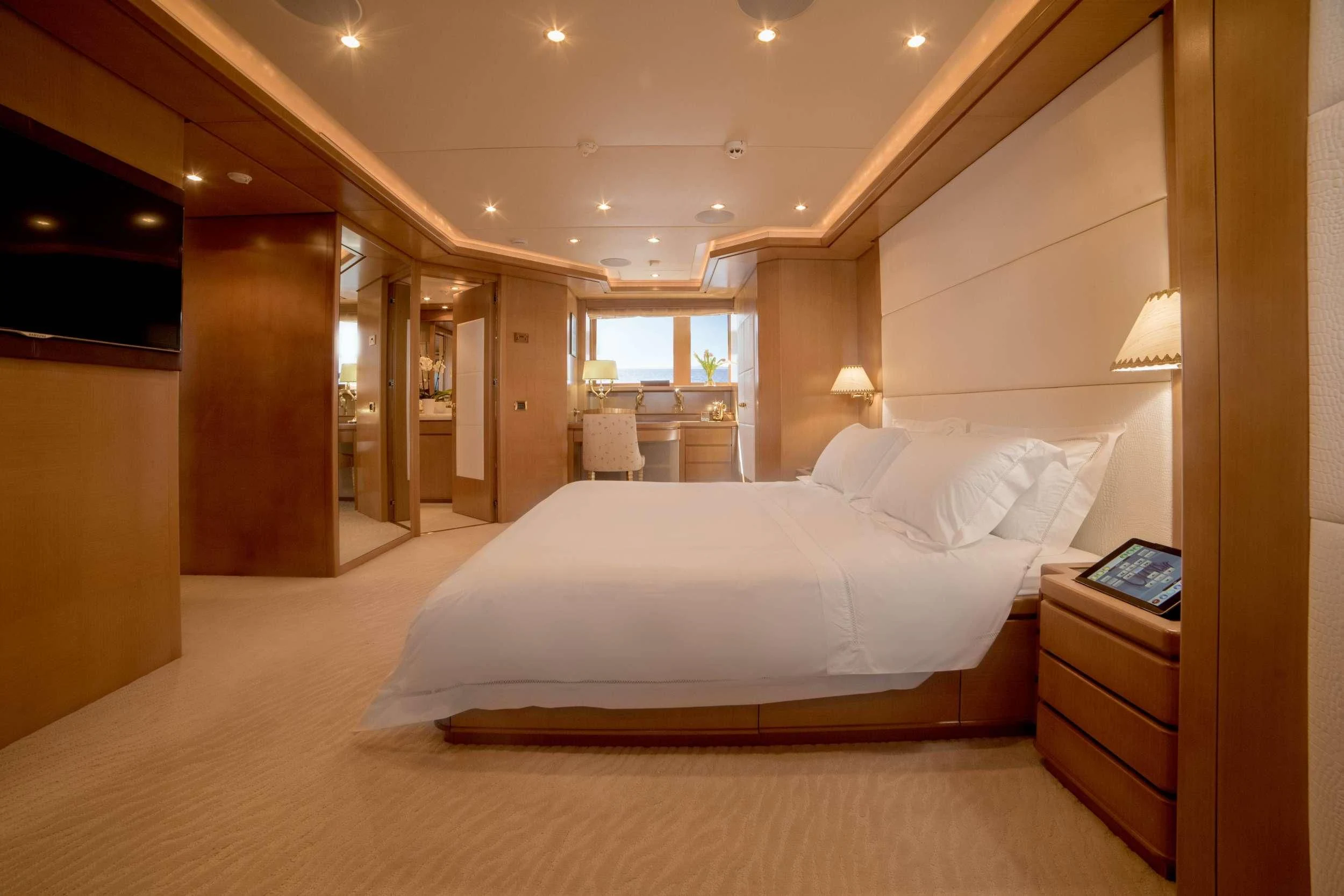 a large hotel room with a large bed aboard OASIS Yacht for Sale