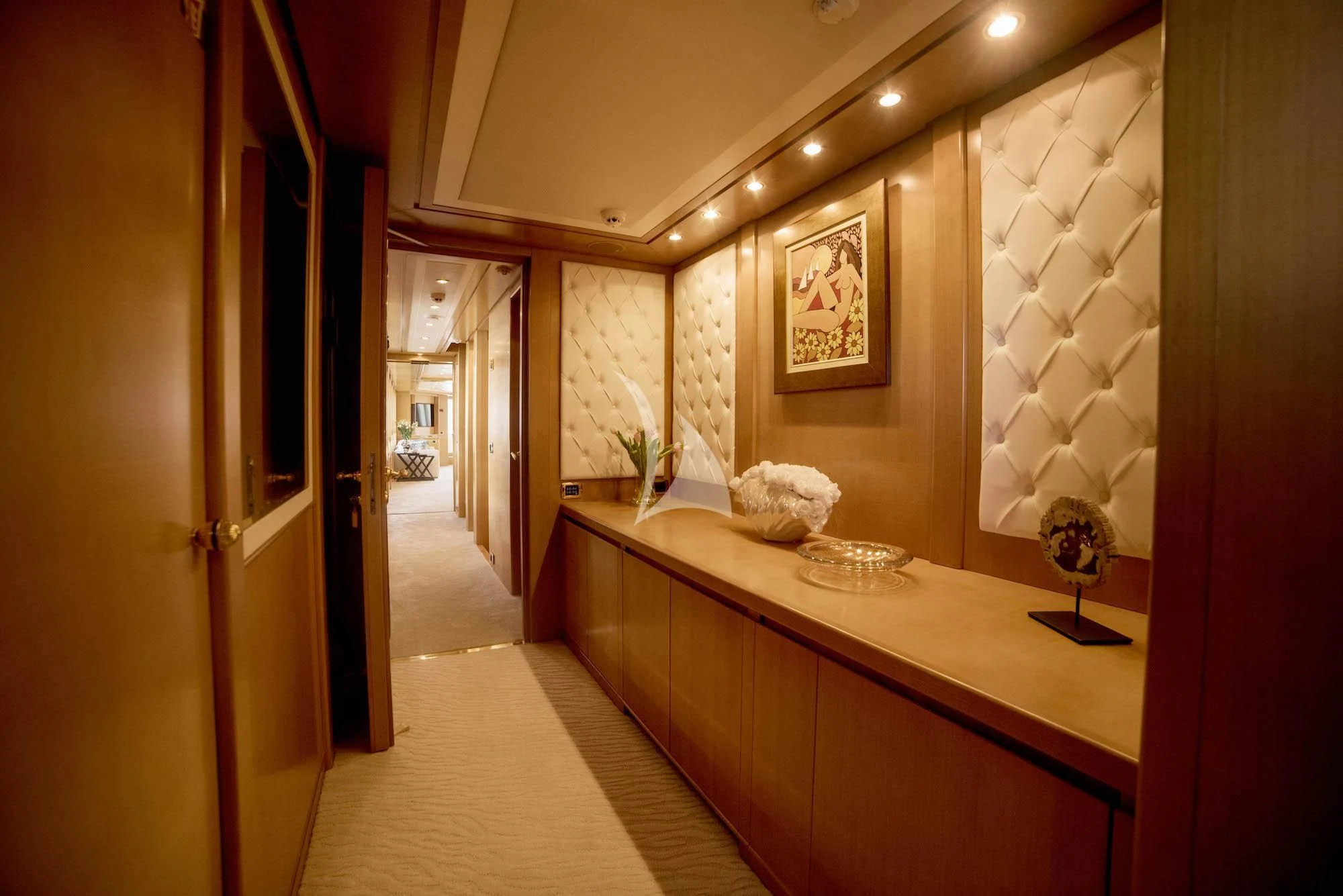 a hallway with a counter and a mirror aboard OASIS Yacht for Sale