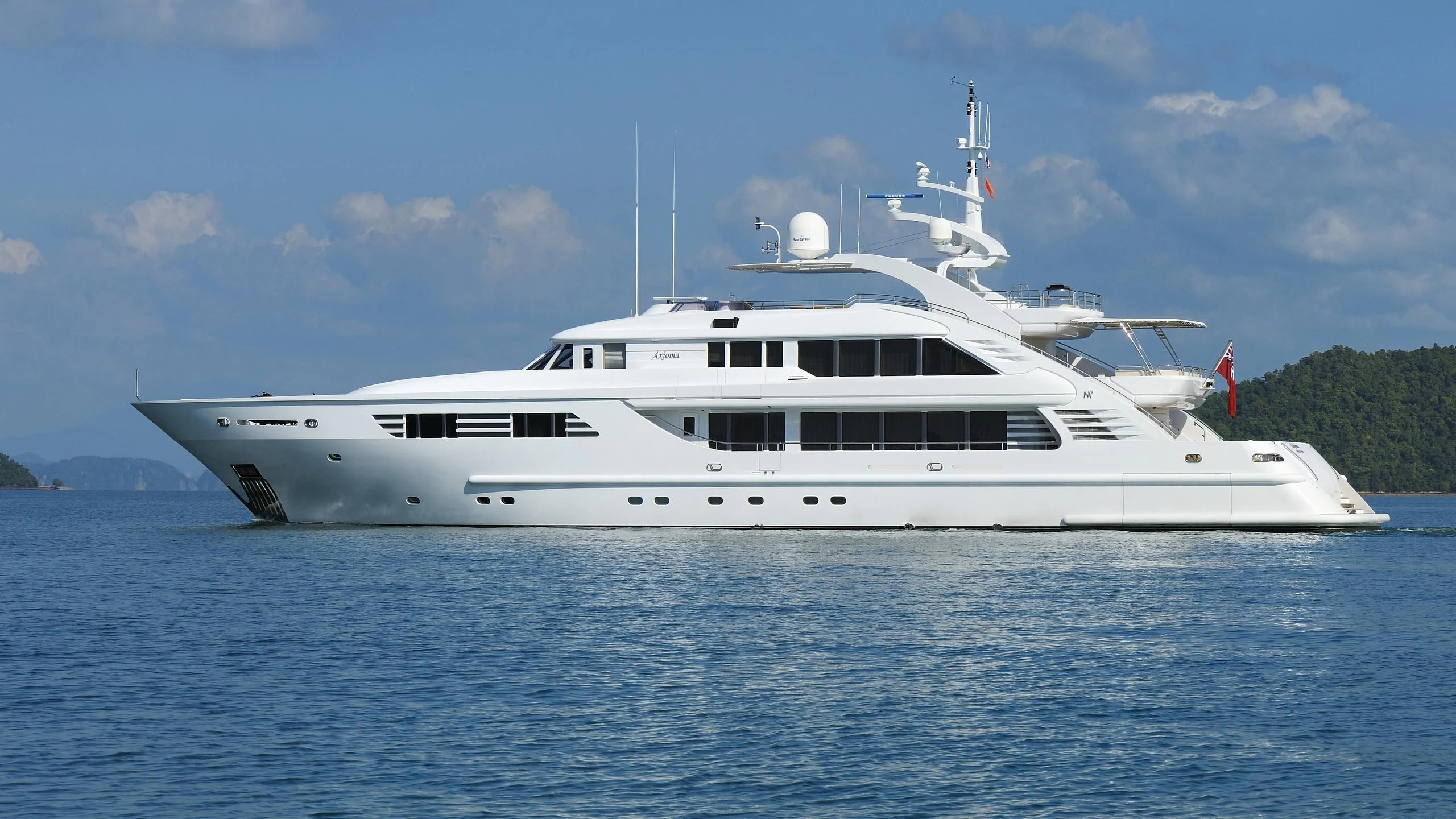 a large white boat in the water aboard OASIS Yacht for Sale