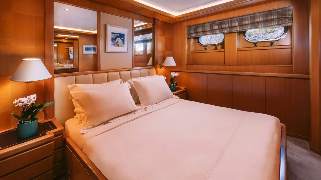 a bed with pillows and pillows aboard OASIS Yacht for Sale