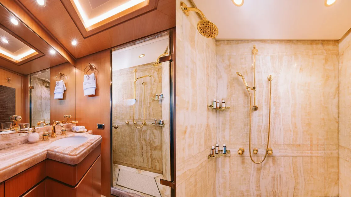 a bathroom with a shower and sink aboard OASIS Yacht for Sale