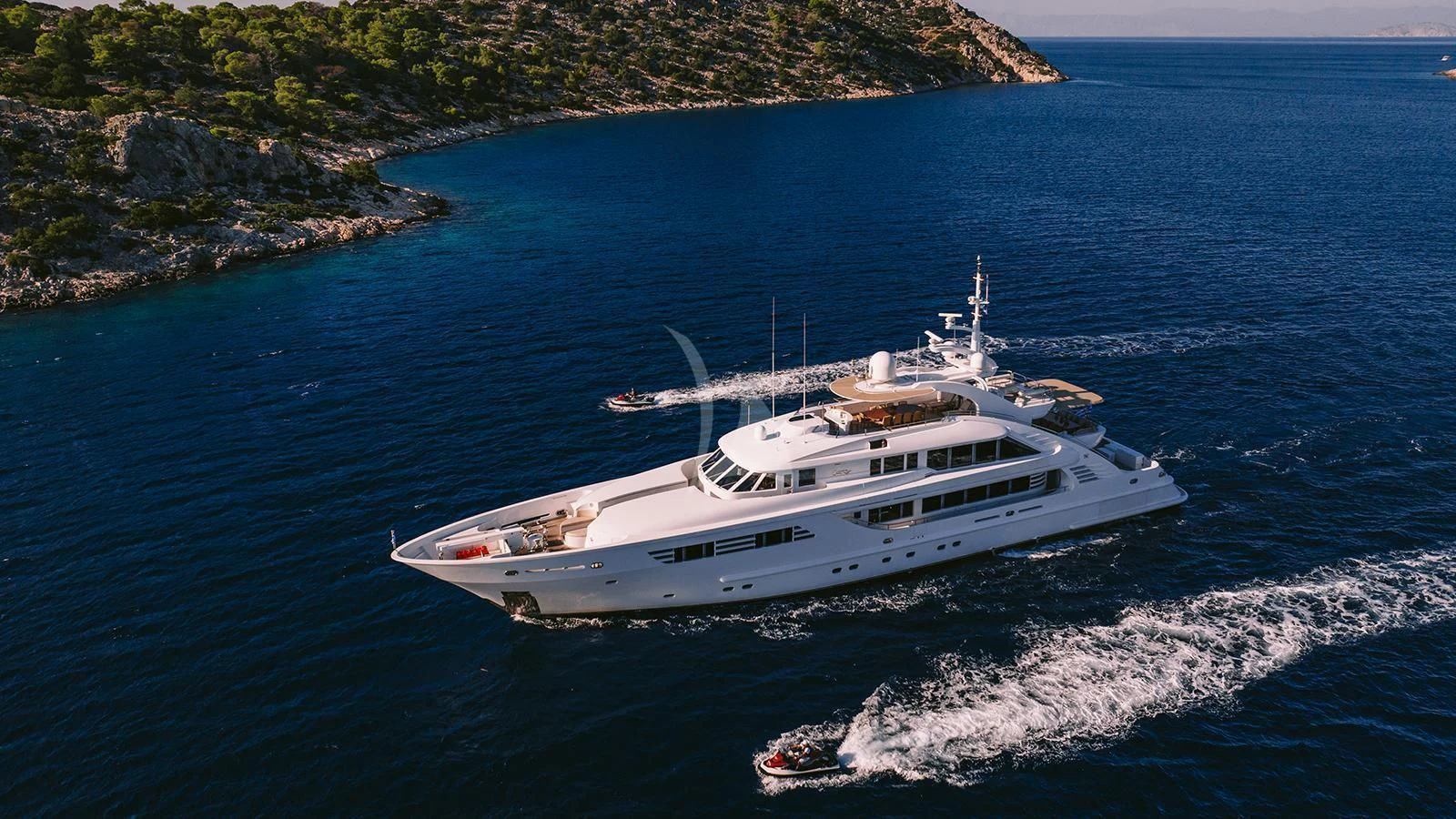 a white boat in the water aboard OASIS Yacht for Sale