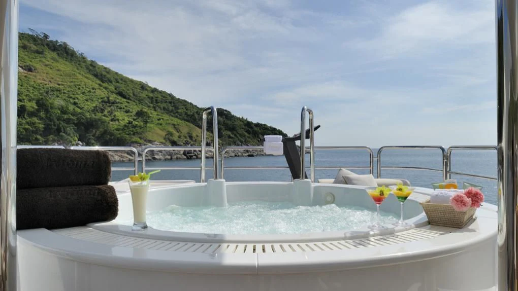 a table with drinks on it aboard OASIS Yacht for Sale