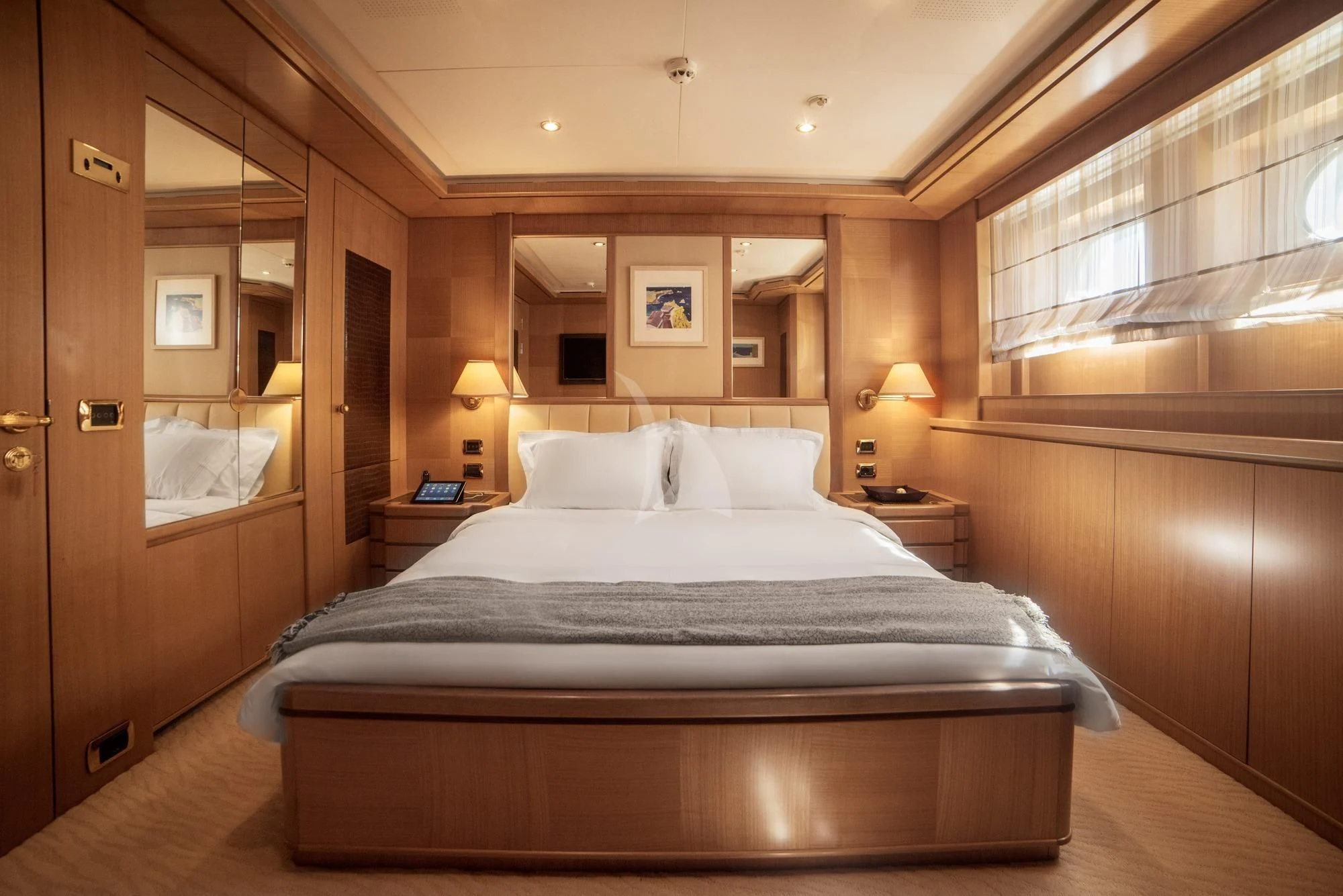 a hotel room with a bed aboard OASIS Yacht for Sale